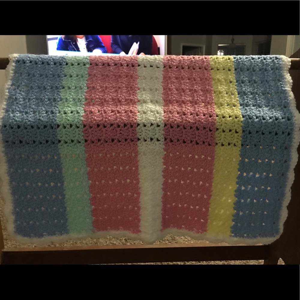 Handmade crocheted striped baby blanket